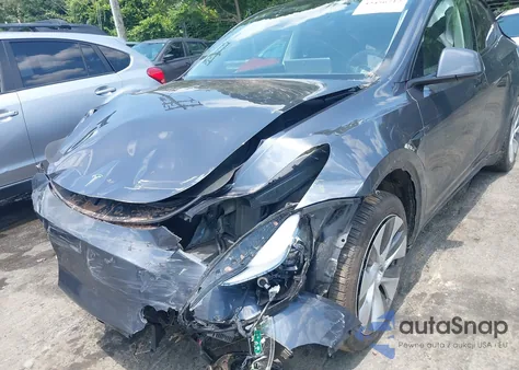 2023 Tesla Model Y Awd/Long Range Dual Motor All-Wheel Drive z USA, uszkodzony, nr VIN 7SAYGDEE5PA184258